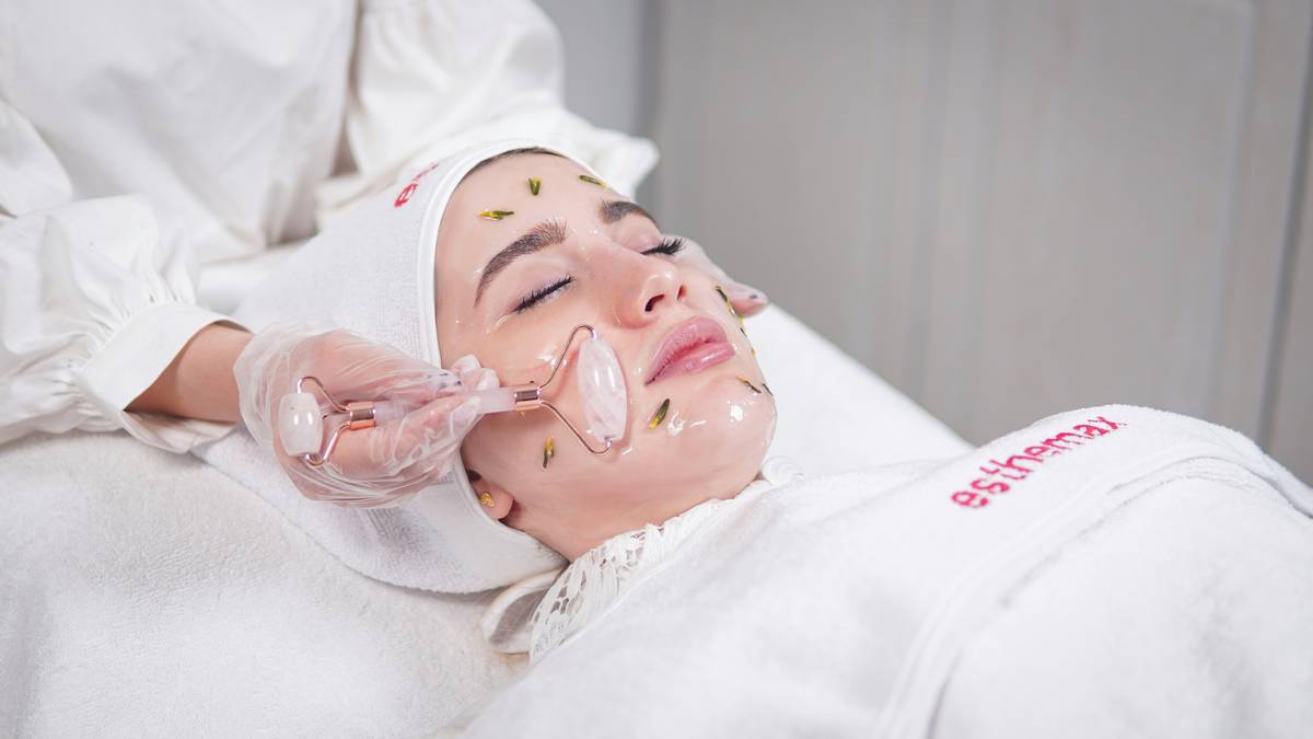 woman applying aromatherapy oil perfect skin care routine after shower